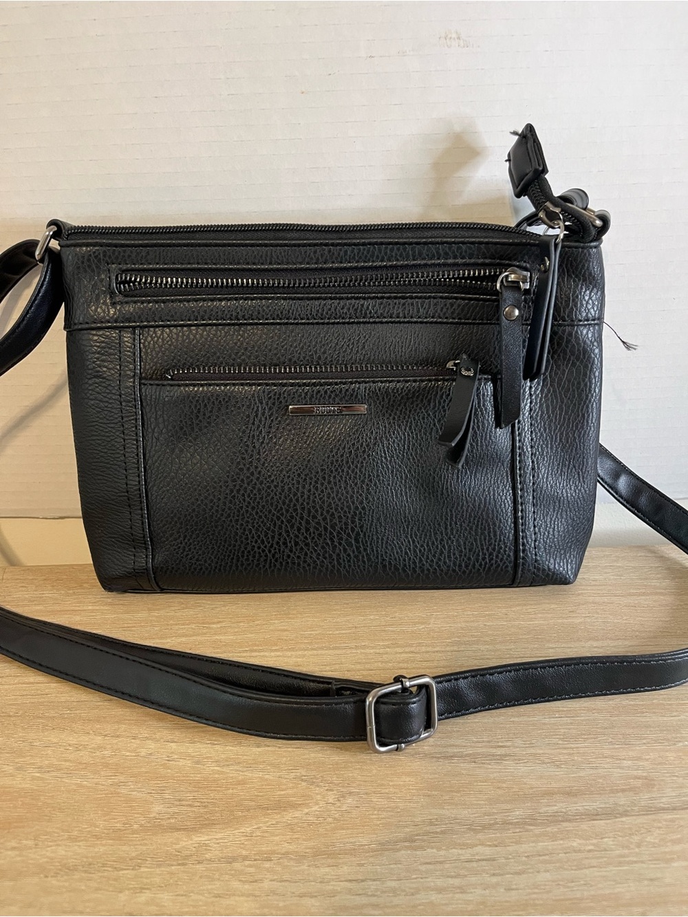 Roots Black Pebbled Crossbody Bag with Gold Accent